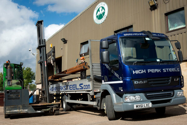 40-years-blue1 High Peak Steels truck being loaded with steel bars